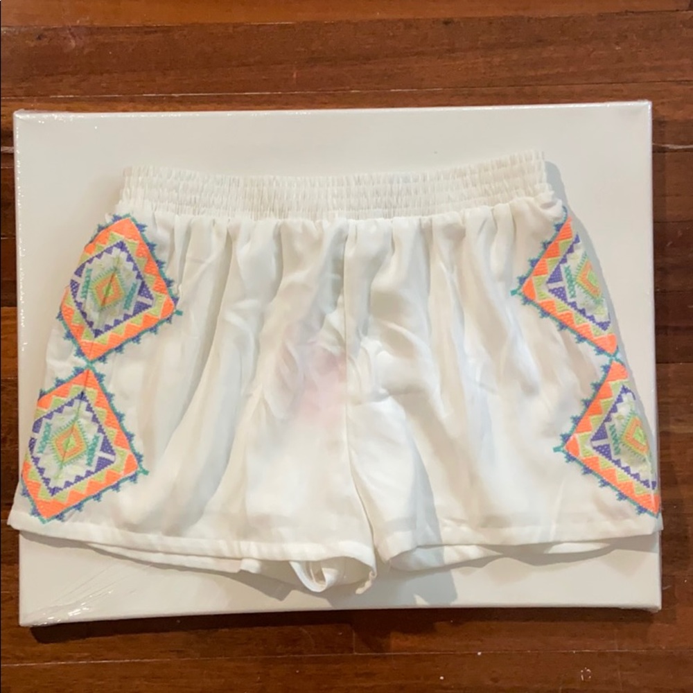 Never before worn beach shorts with intact tag
